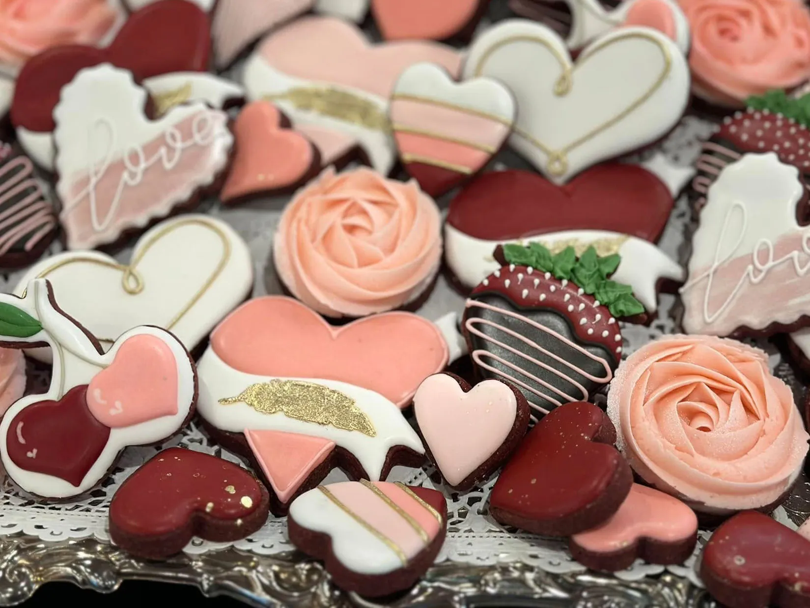 Heart-shaped decorated cookies and a treat tray