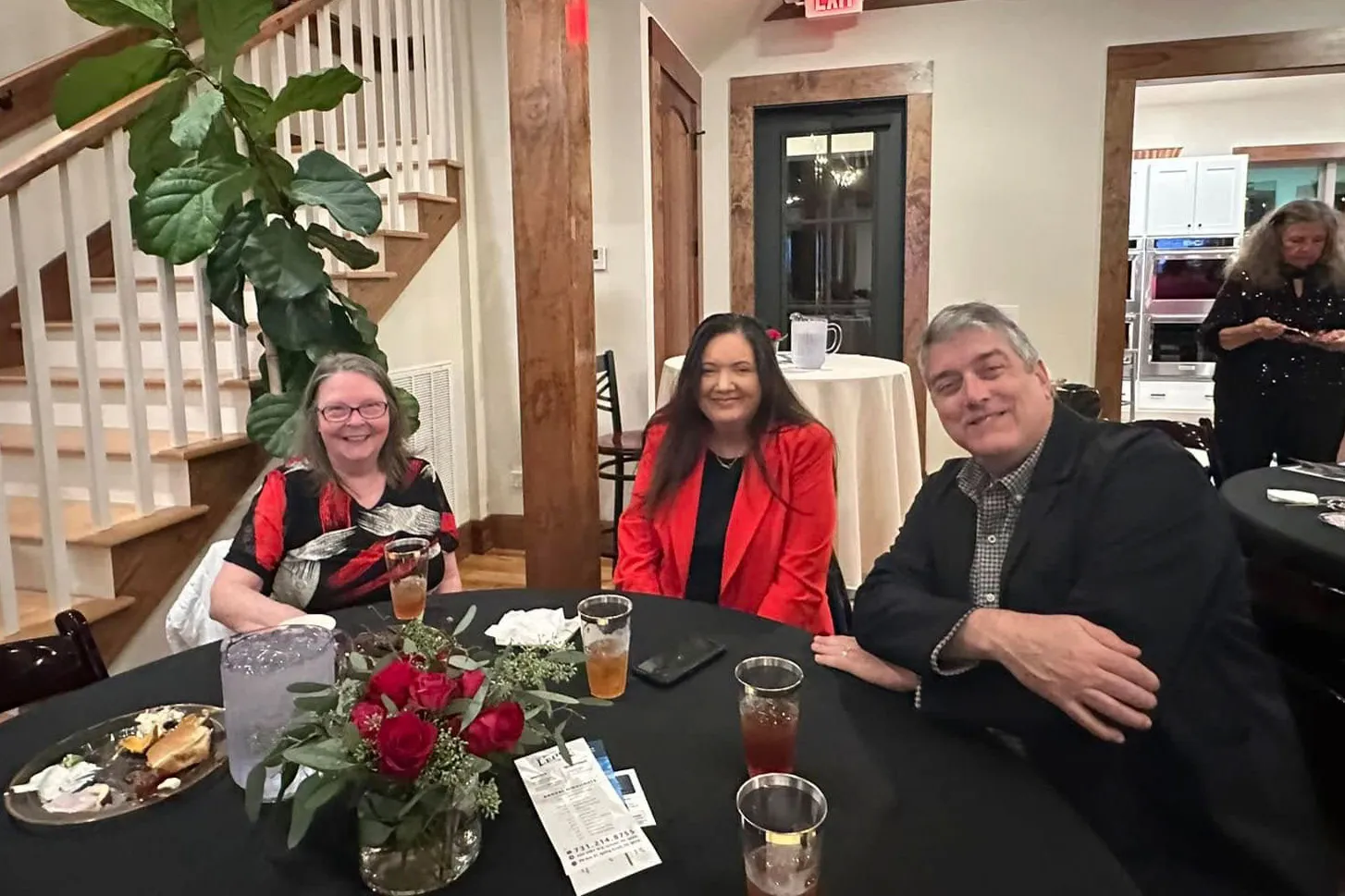 Guests smiling at their table