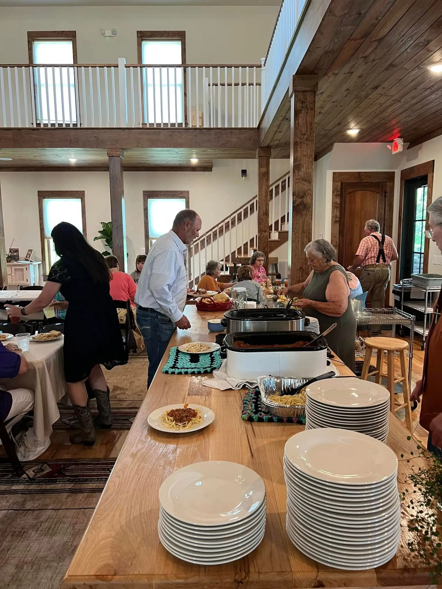 Guests filling plates at the buffet