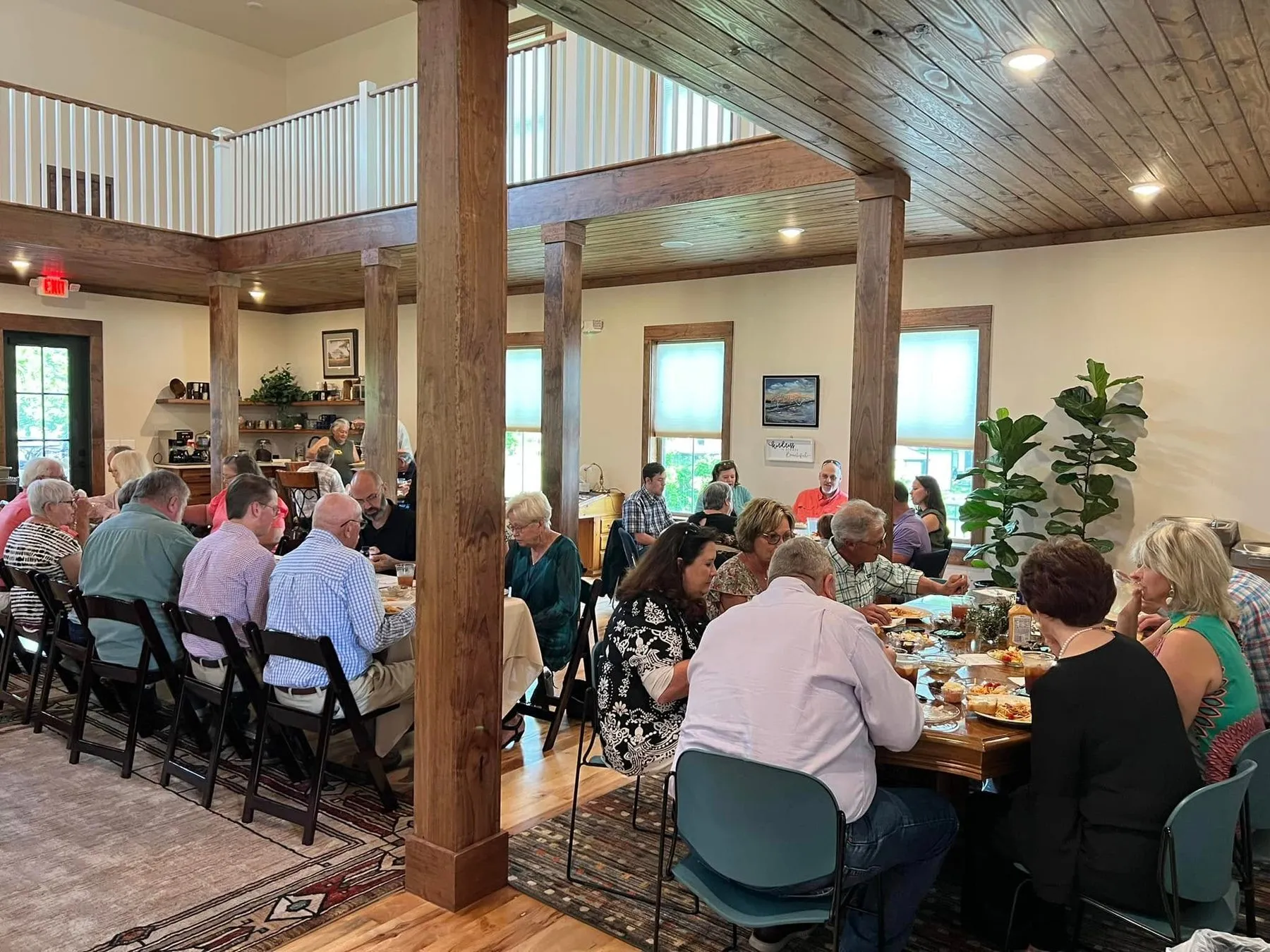 Guests eating together at long tables