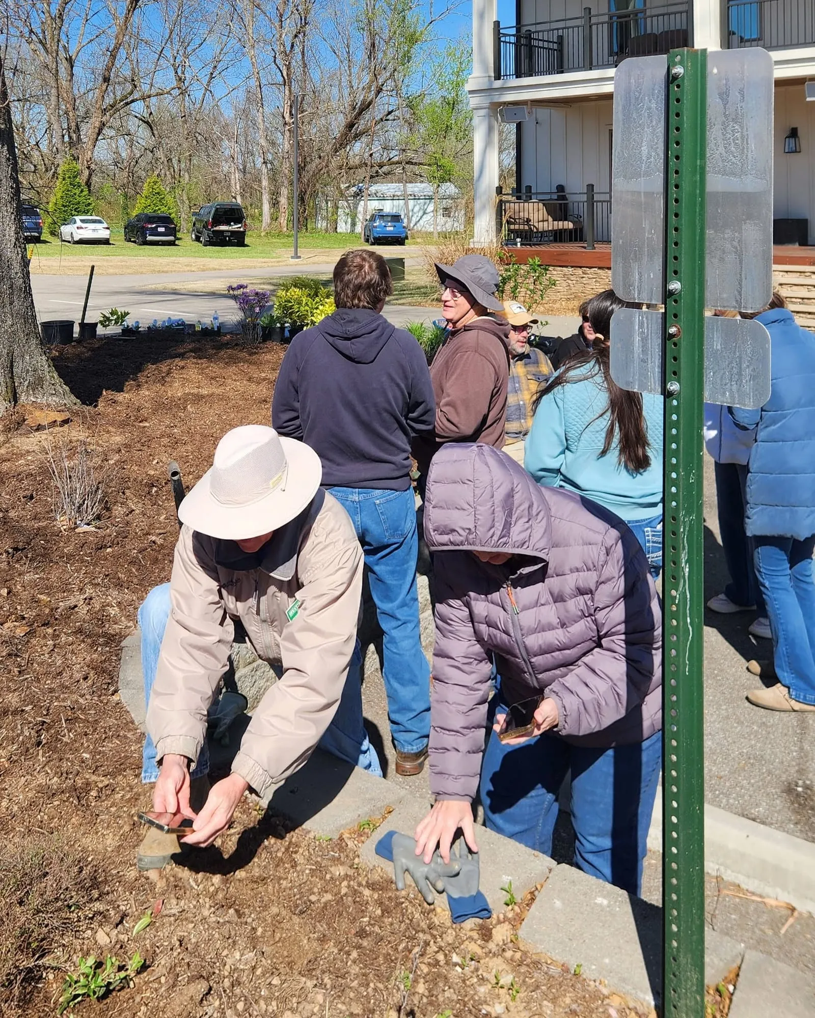 Master Gardeners and volunteers planting in the garden